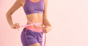 Woman measuring waist after weight loss injections treatment in New York, NY